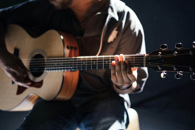 Man playing a guitar